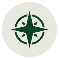 A green compass rose symbol on a white circular background.