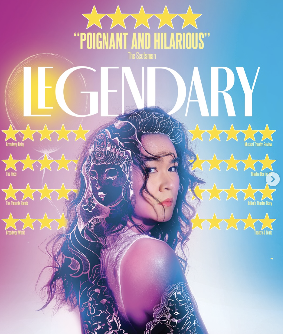 Promotional poster for the musical 'Legally Blonde' featuring a young woman with curly hair and tattoos, with bright pink and blue background, yellow star reviews, and large title text.