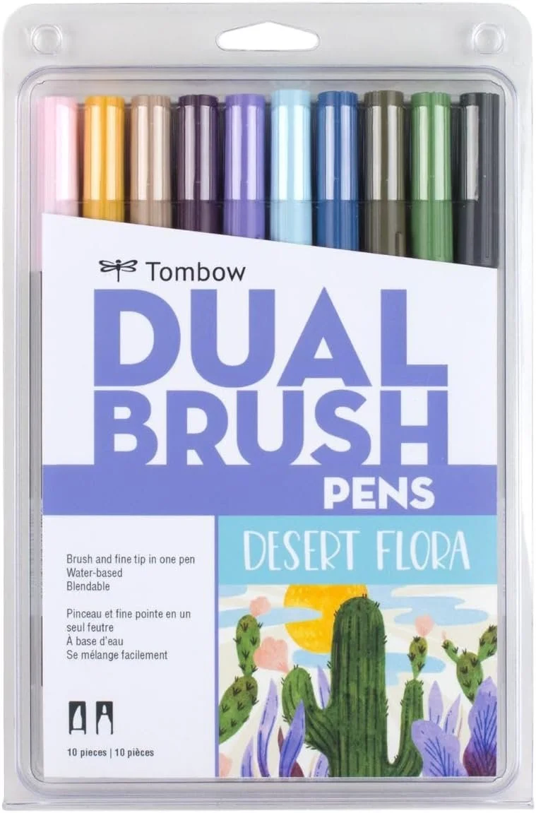 Set of 10 Tombow Dual Brush Pens in various colors, packaging with landscape desert flora illustration, featuring cacti and a sunset.