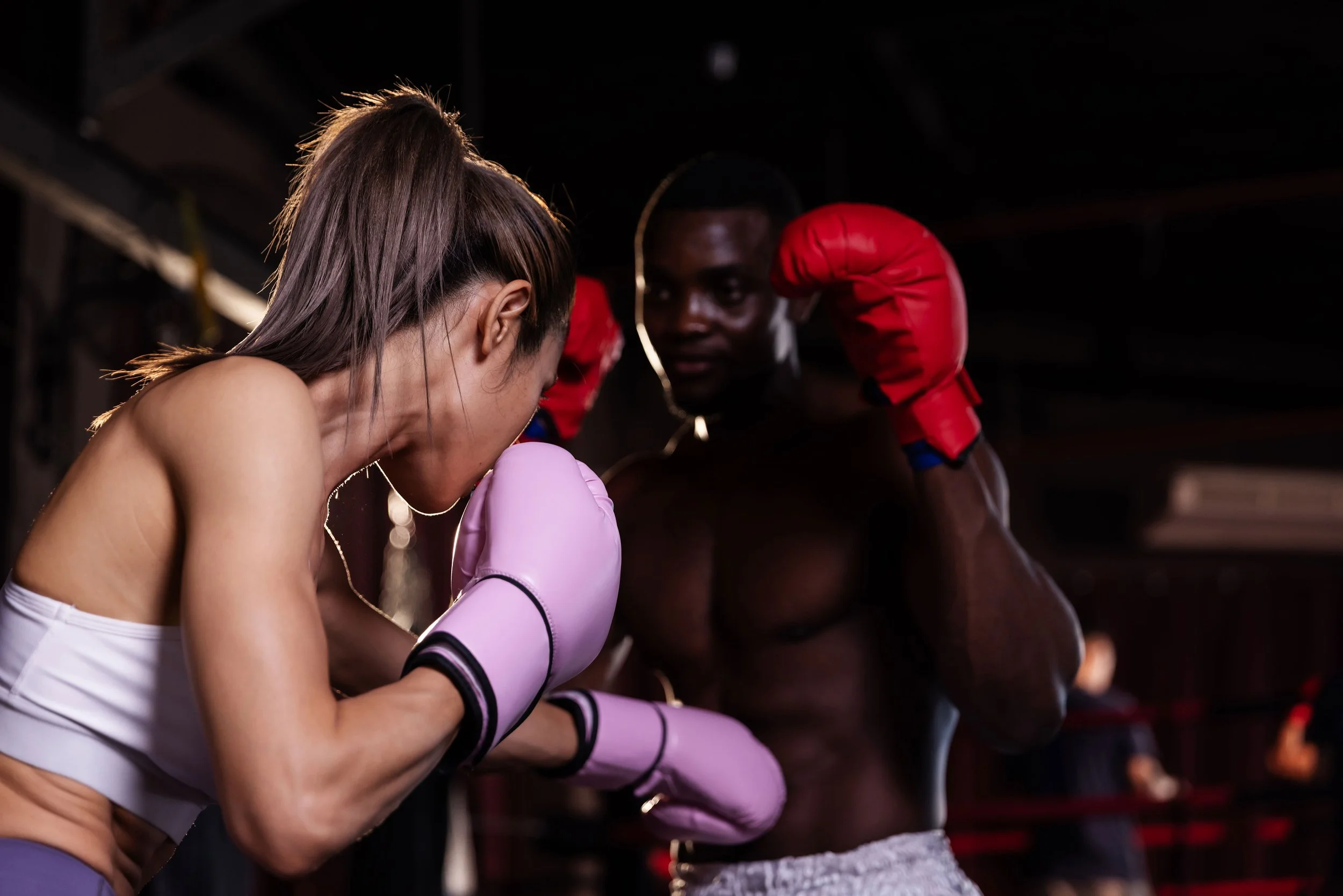 a-female-boxer-in-pink-gloves-leans-in-with-a-guar-2026-01-08-08-14-43-utc.jpg