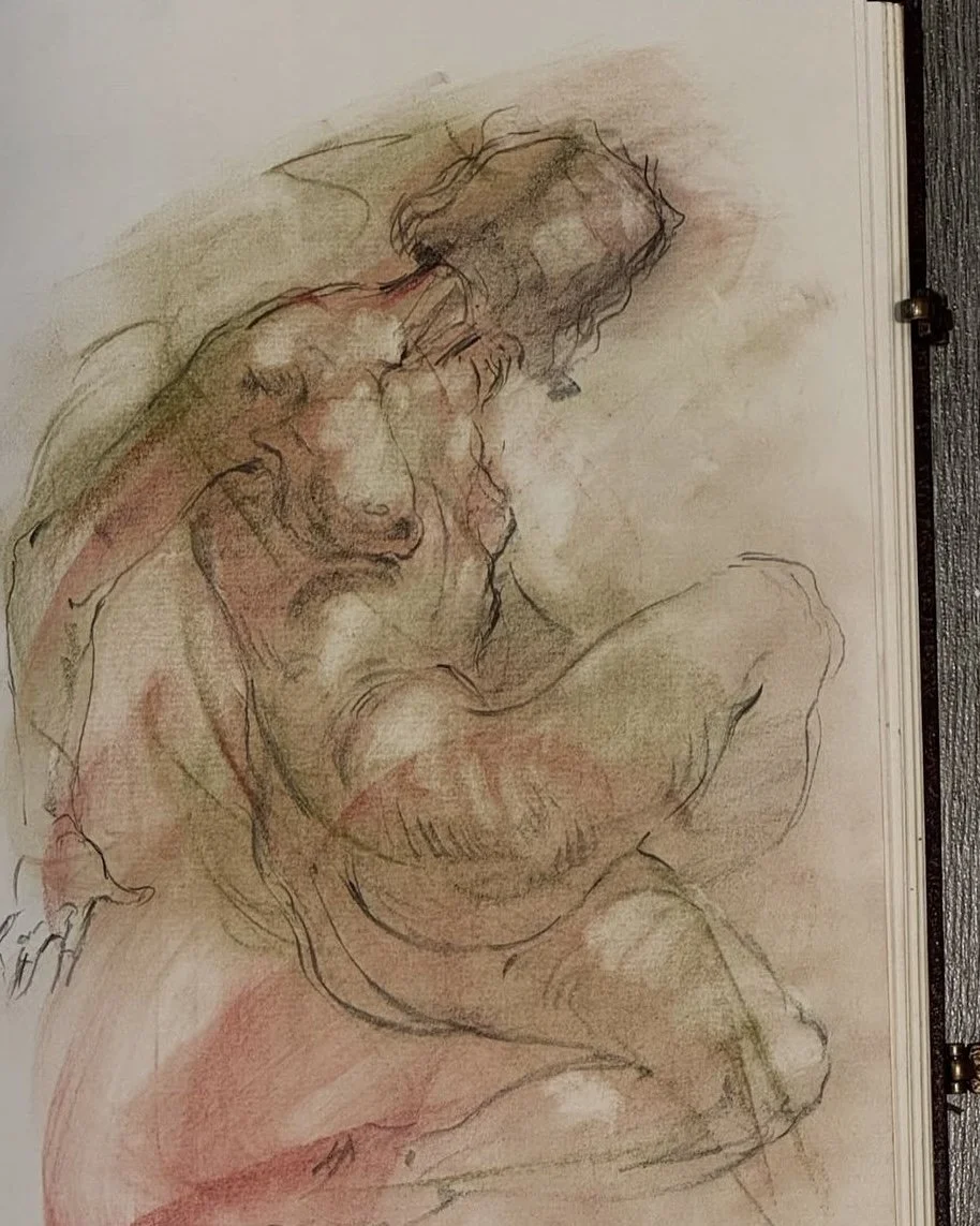 A sketch of a seated nude woman, with short hair, rendered in soft, loose lines with touches of color to emphasize form and shading.