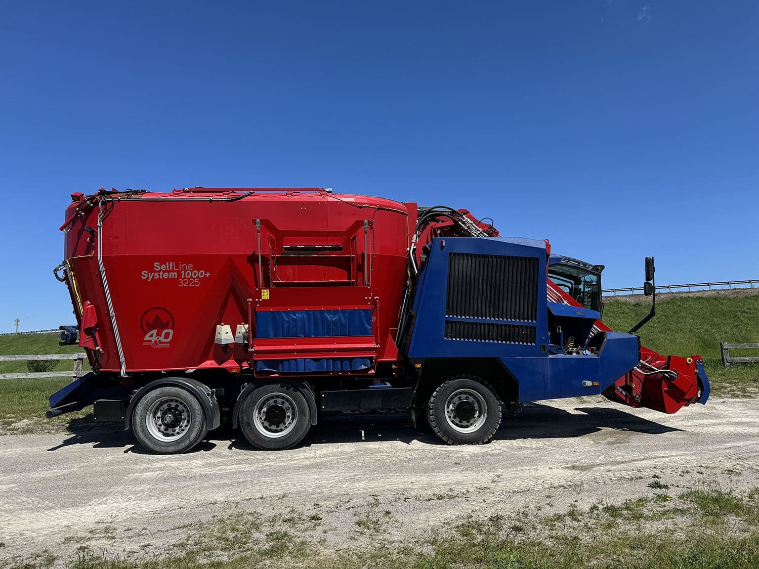 Right side profile view of a used 27 cubic meter Siloking SelfLine 4.0 self-propelled feed mixer showing the engine cooling package panels and direct discharge door layout.