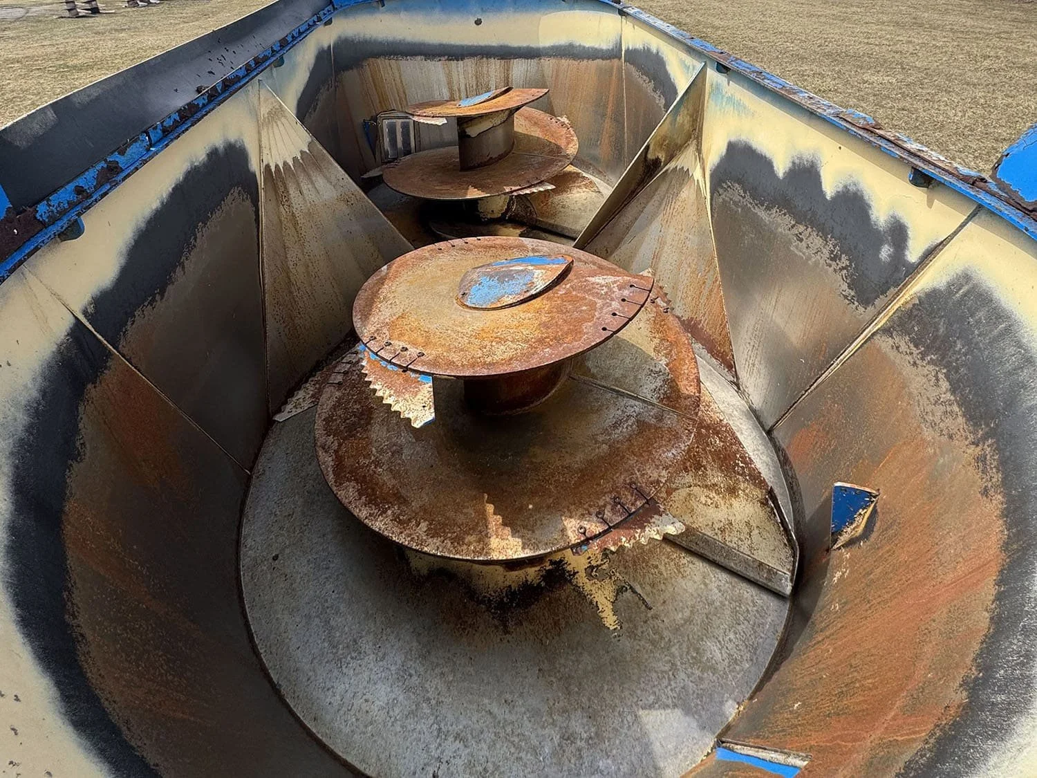 Overhead interior view of the twin vertical mixing augers and tub walls of a used Patz 2400 Series II 650XH feed mixer wagon.