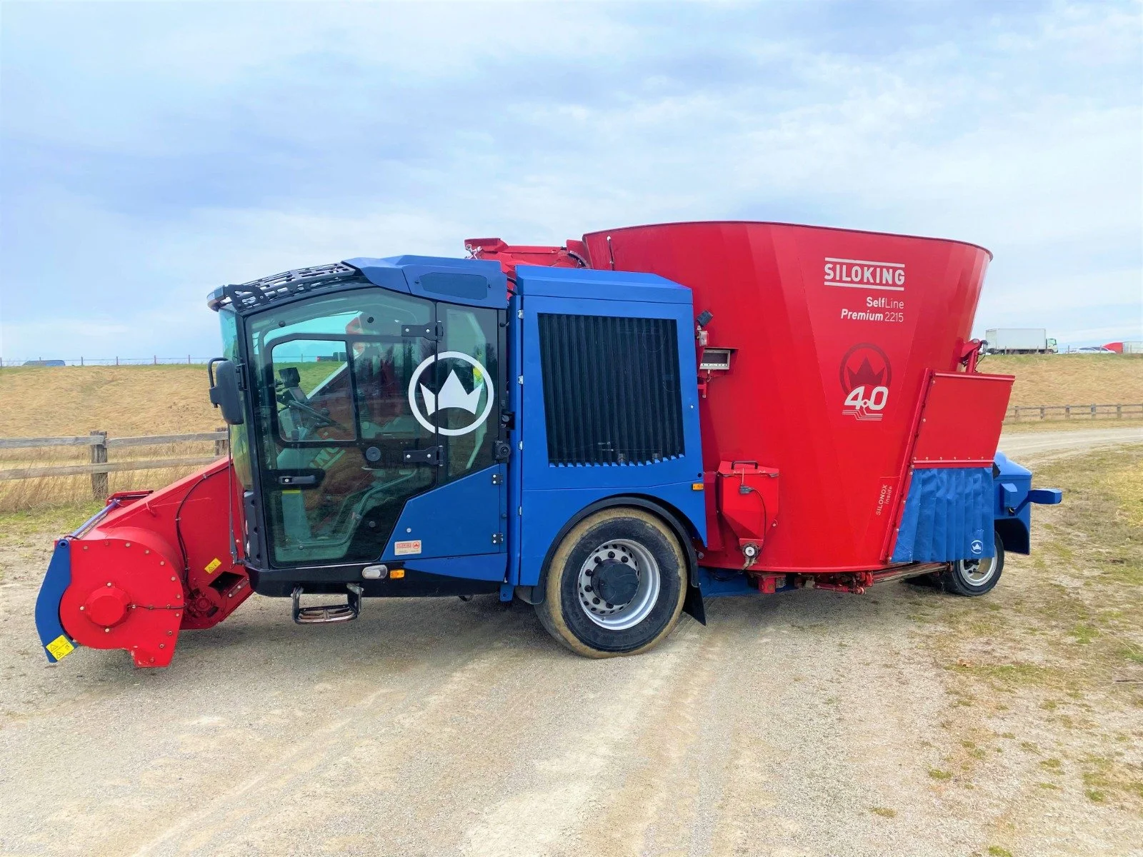 Left profile view of 2020 Siloking 2215 showing operator cab and left-hand feedout conveyor belt.