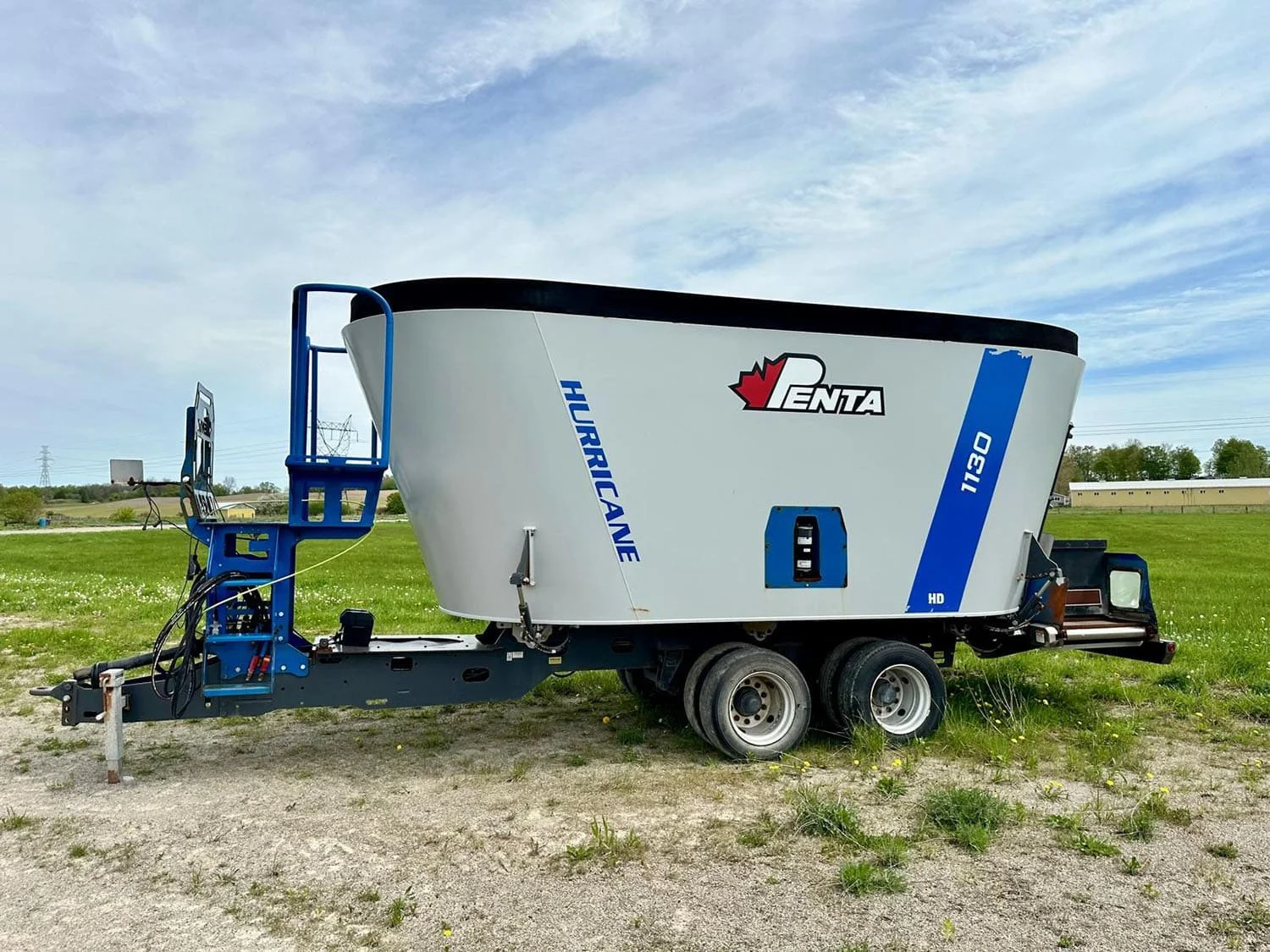 Used 2017 Penta 1130HD trailed vertical TMR mixer wagon with a tandem axle setup for sale at Siloking Canada.