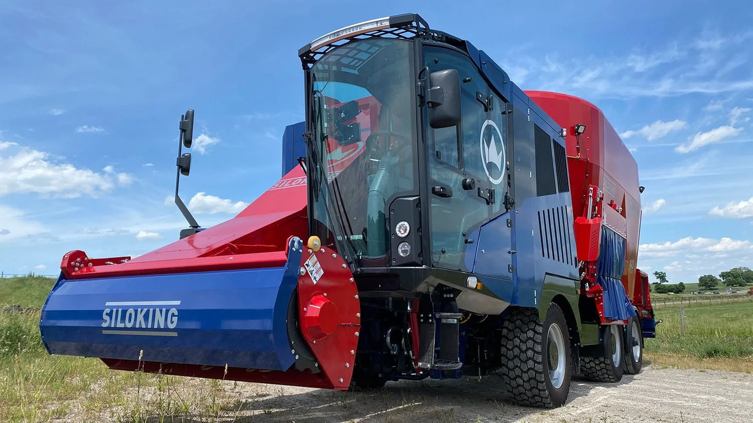 Low-angle front-end perspective of a Siloking SelfLine System 1000 plus showing the spacious operator cab and high-volume silage milling head.