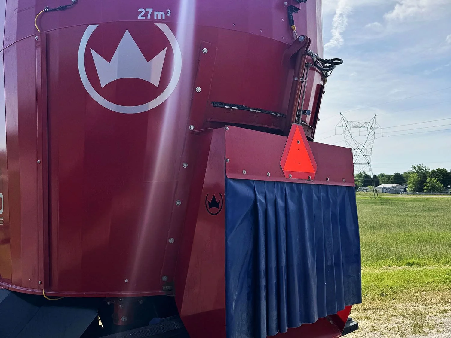 Close-up rear view of the red mixing tub on a 2023 Siloking SelfLine 4.0 self-propelled mixer showing the rear center direct discharge door and protective rubber curtain.