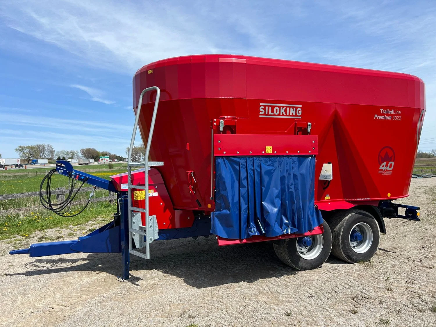 2026 Siloking TrailedLine 4.0 Premium 3022 TMR mixer side view showing the heavy-duty side discharge door, ladder, and hitch.