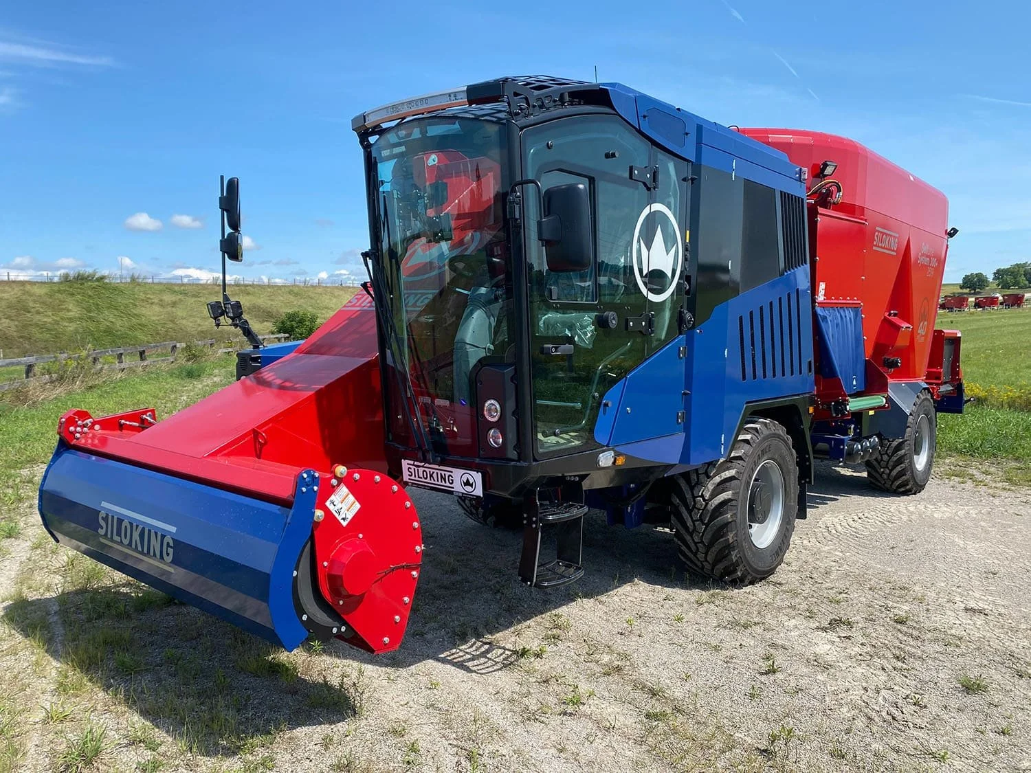 Front three-quarter perspective view of a new Siloking SelfLine 4.0 System 300+ 2519-22 4x4 self-propelled mixer highlighting the driver cab and the front silage milling cutter head.