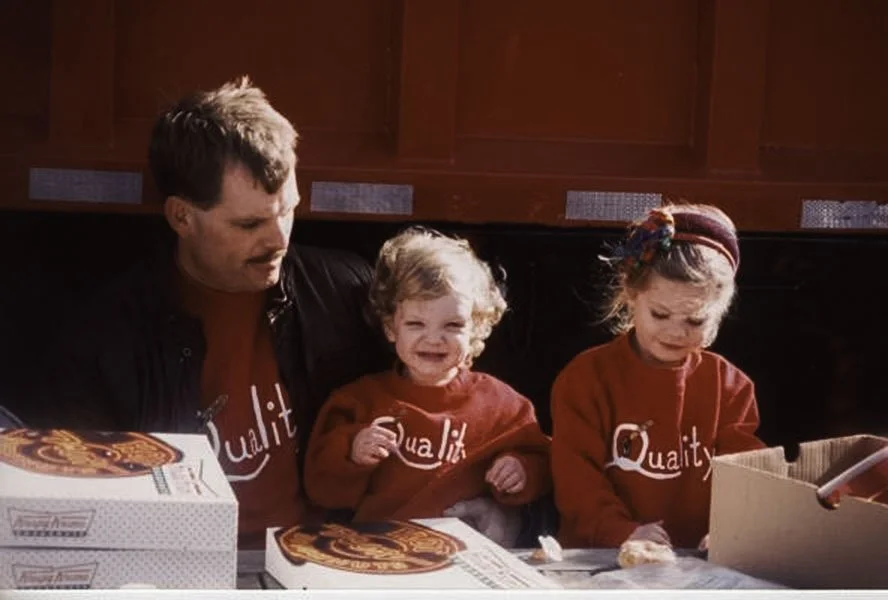 A picture of our founder with his kids, one of which, Lindy, now works for the Team