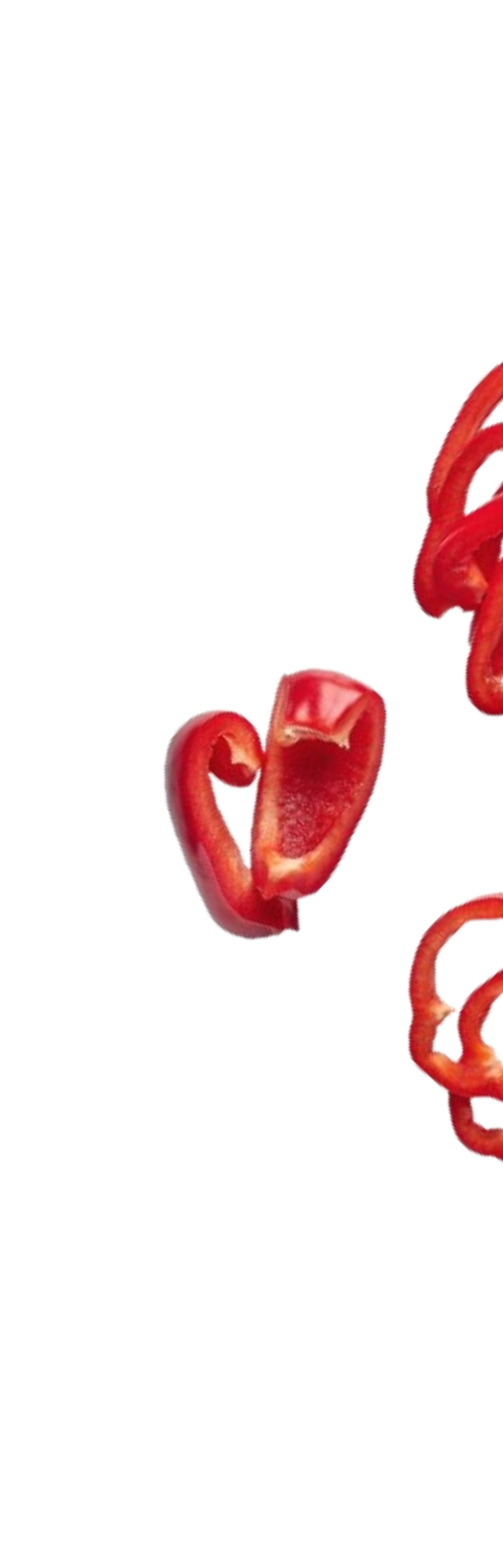 Close-up of red bell pepper slices on a black background.