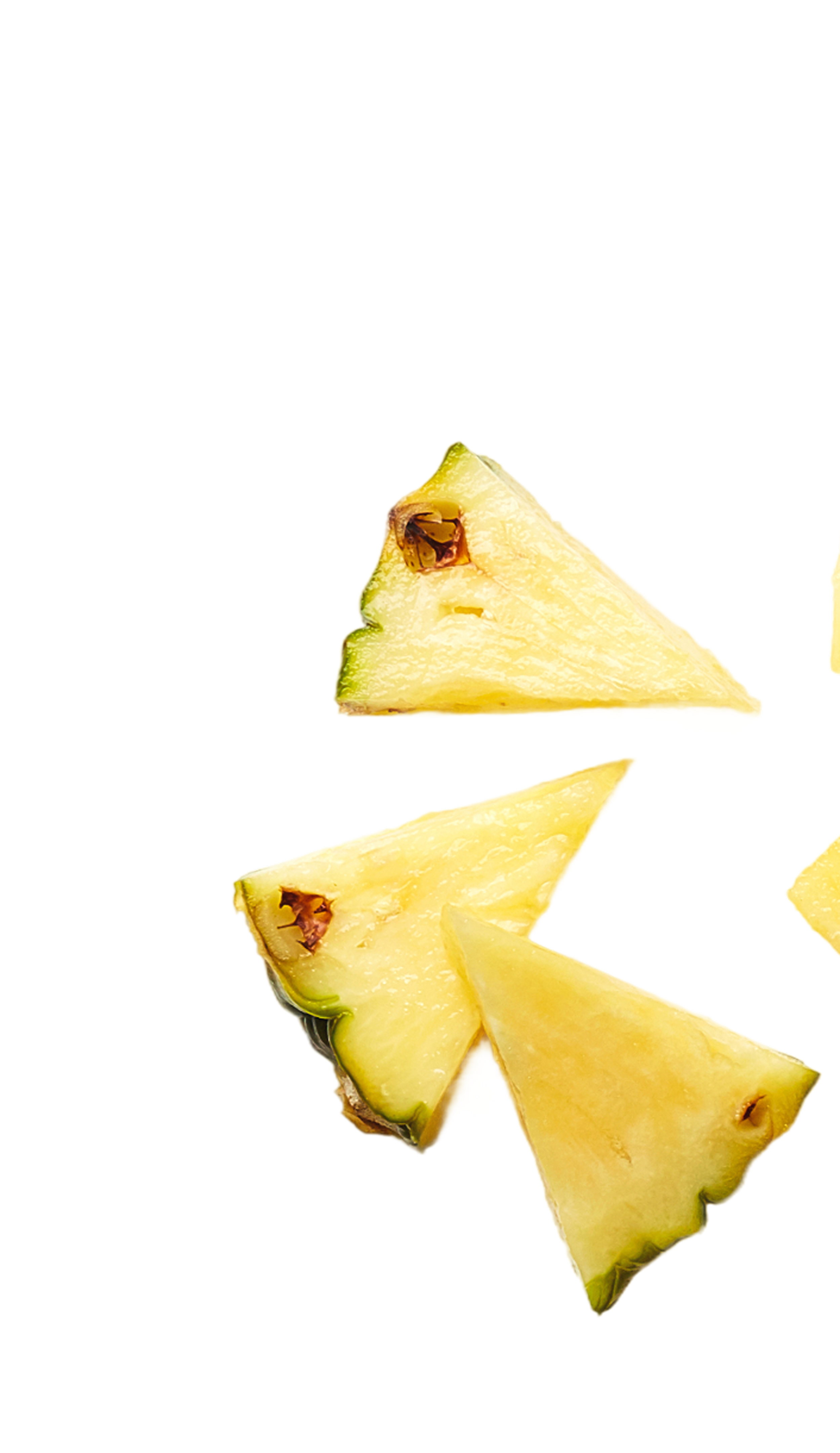 Slices of fresh pineapple on a black background.