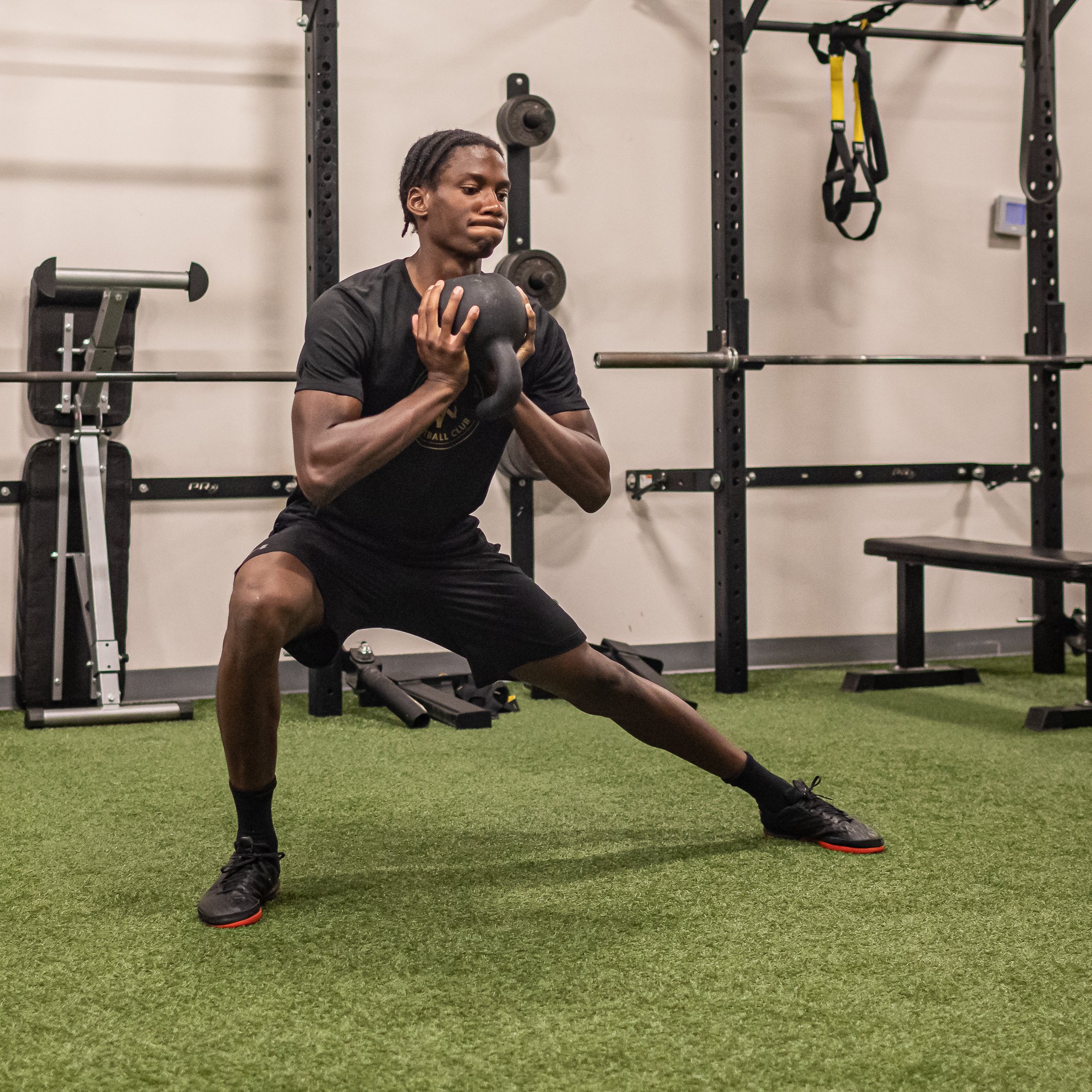 Athlete performing lateral strength exercise during training session