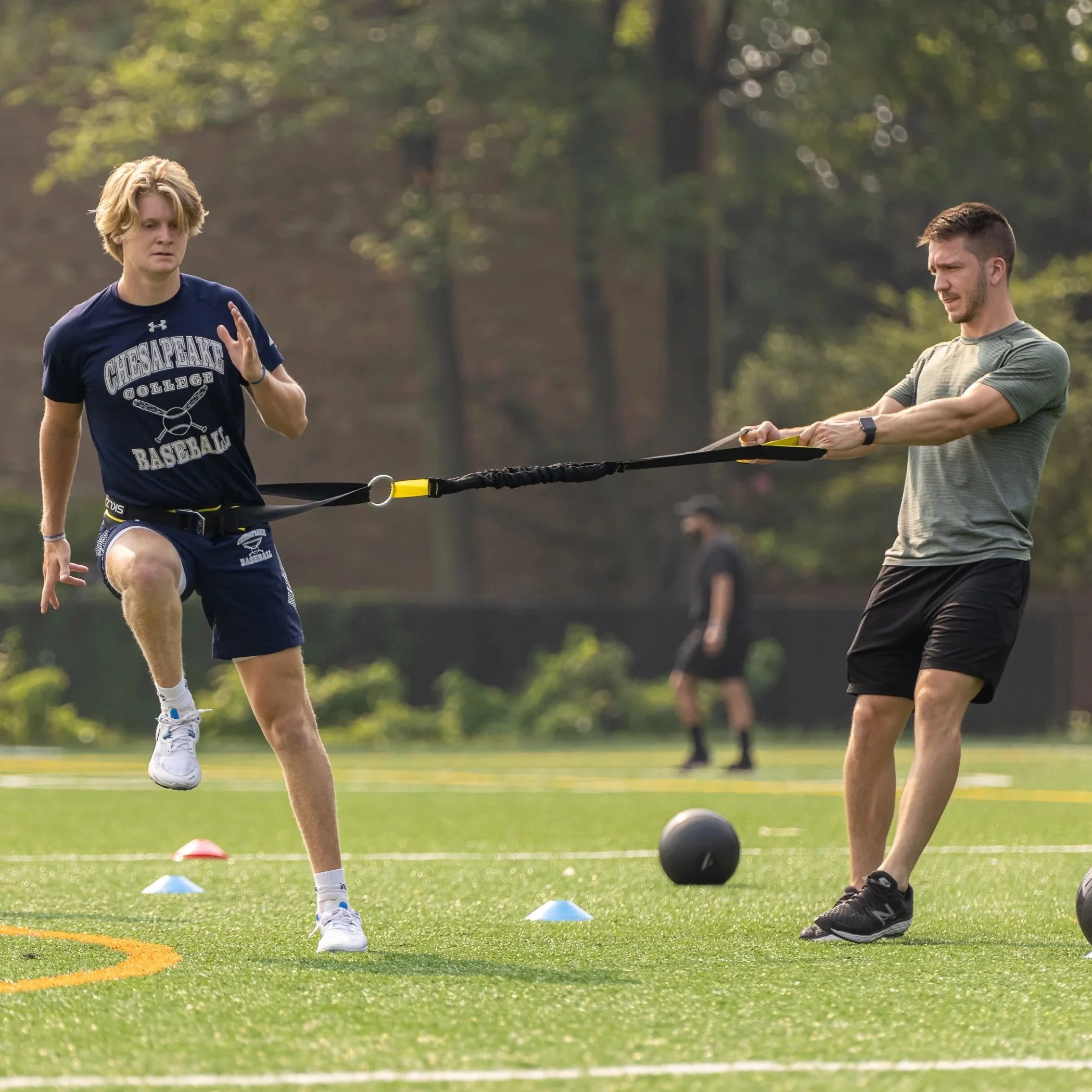 Athlete performing lateral resisted sprint training at SHIFT Performance Training