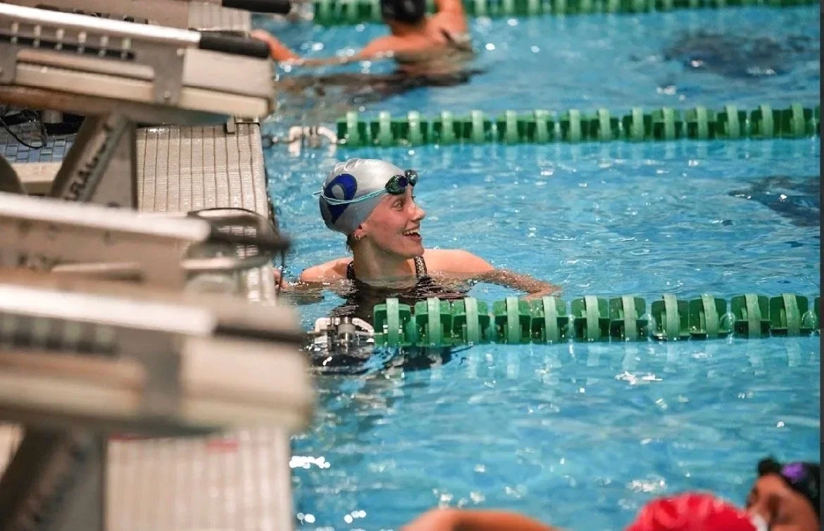 Swimmer finishing race