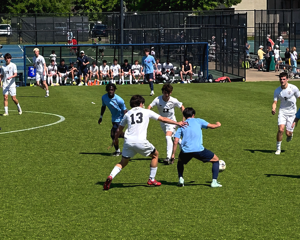 Soccer players battling for the ball