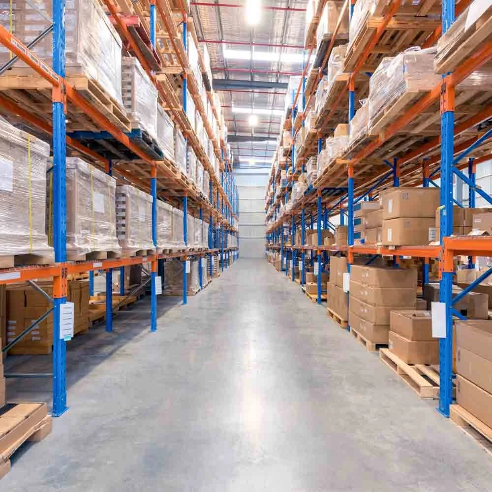 Interior of modern logistics warehouse with pallet racking illustrating industrial asset management