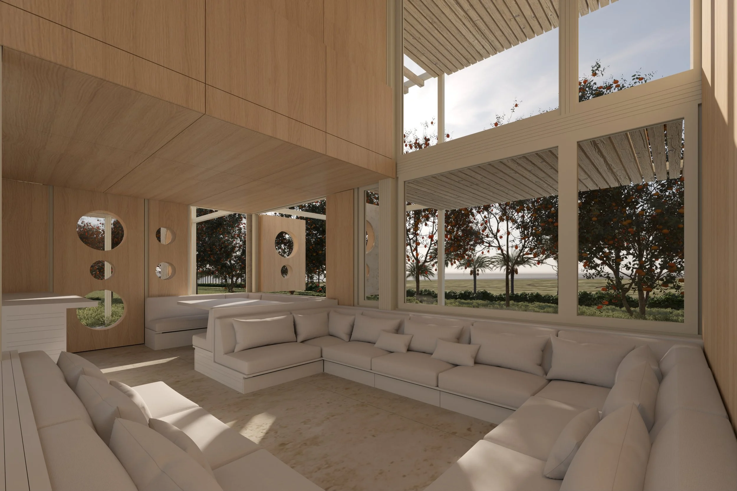 Salón interior con paredes de madera, ventanales grandes que muestran árboles y cielo, y sillones blancos en forma de L.