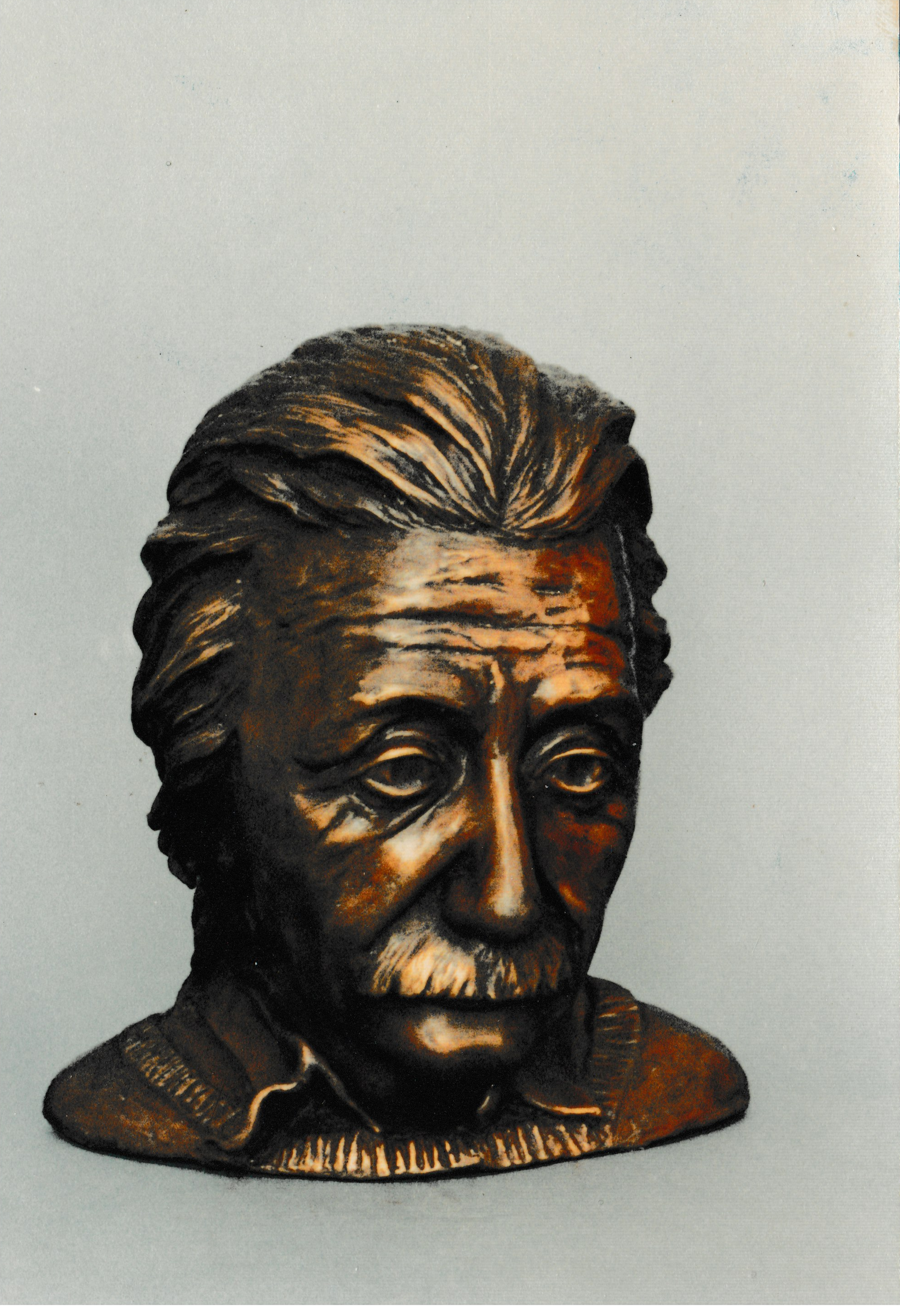 Bronze portrait bust of Albert Eienstein, a man with swept-back hair, mustache, and deeply lined face.