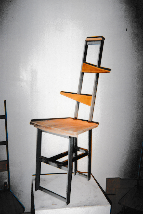 Side-angle view of the chair showing offset wooden supports within the frame.