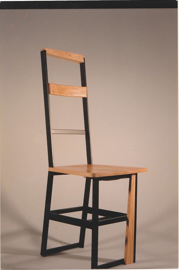 Three-quarter view of the chair emphasizing its architectural proportions.
