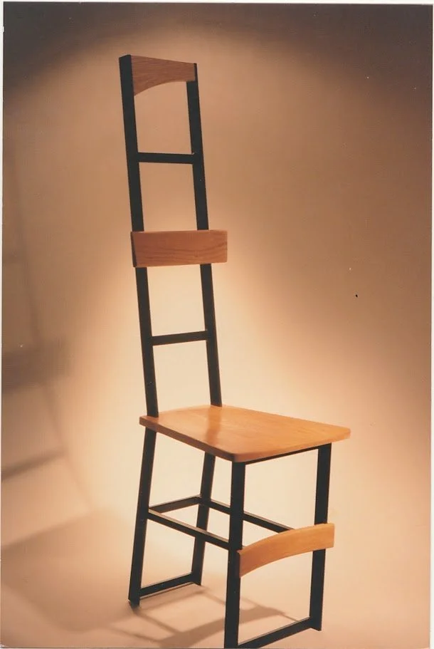 Three-quarter view of a tall chair showing the relationship between the seat and elongated backrest.