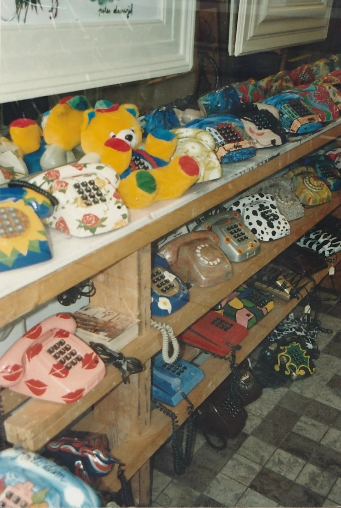 Small market display filled with colorful handcrafted items and souvenirs.