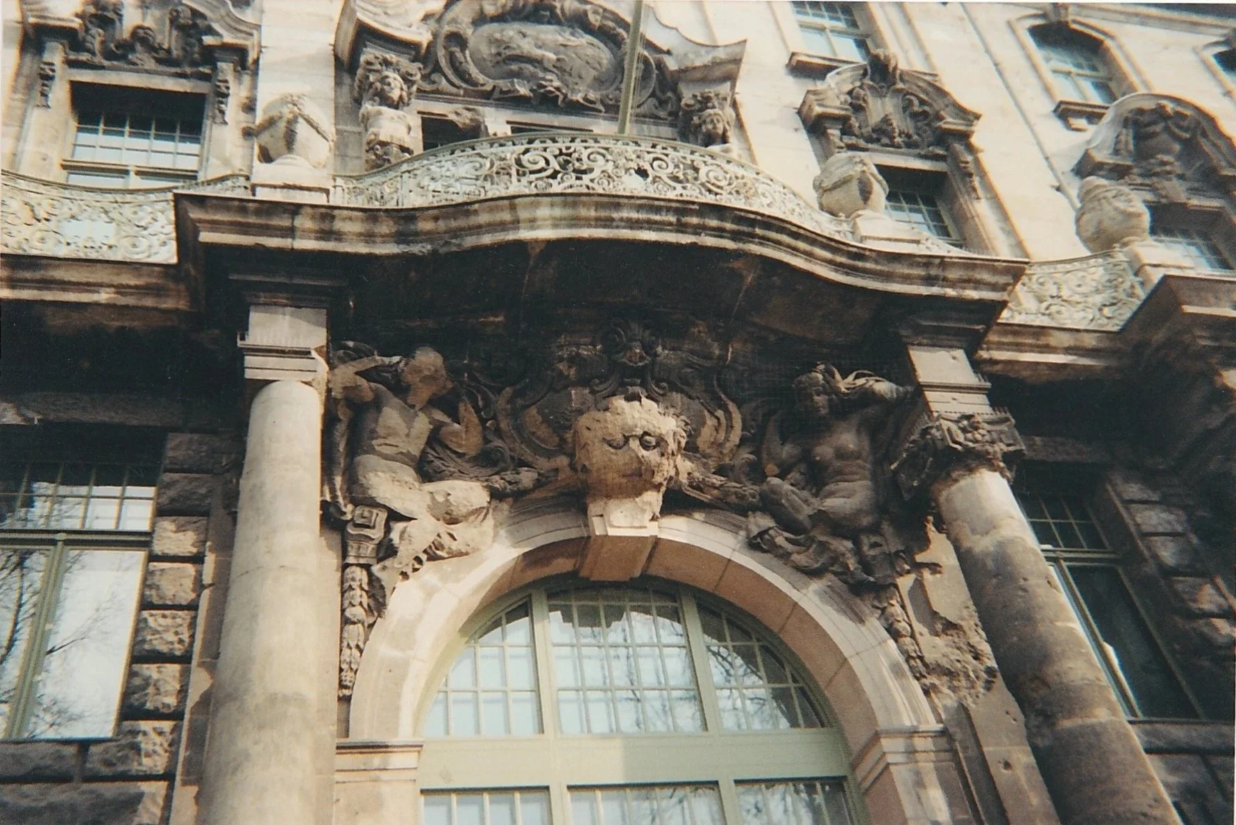 Highly decorated Baroque building façade filled with carved stone figures and ornamentation.