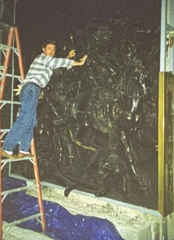 Whitney Wolf II on a latter doing restoration work.