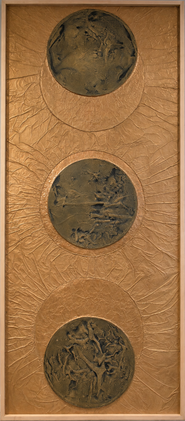 Three dark orbs align within a radiant golden field. Shown close up in a wooden frame.