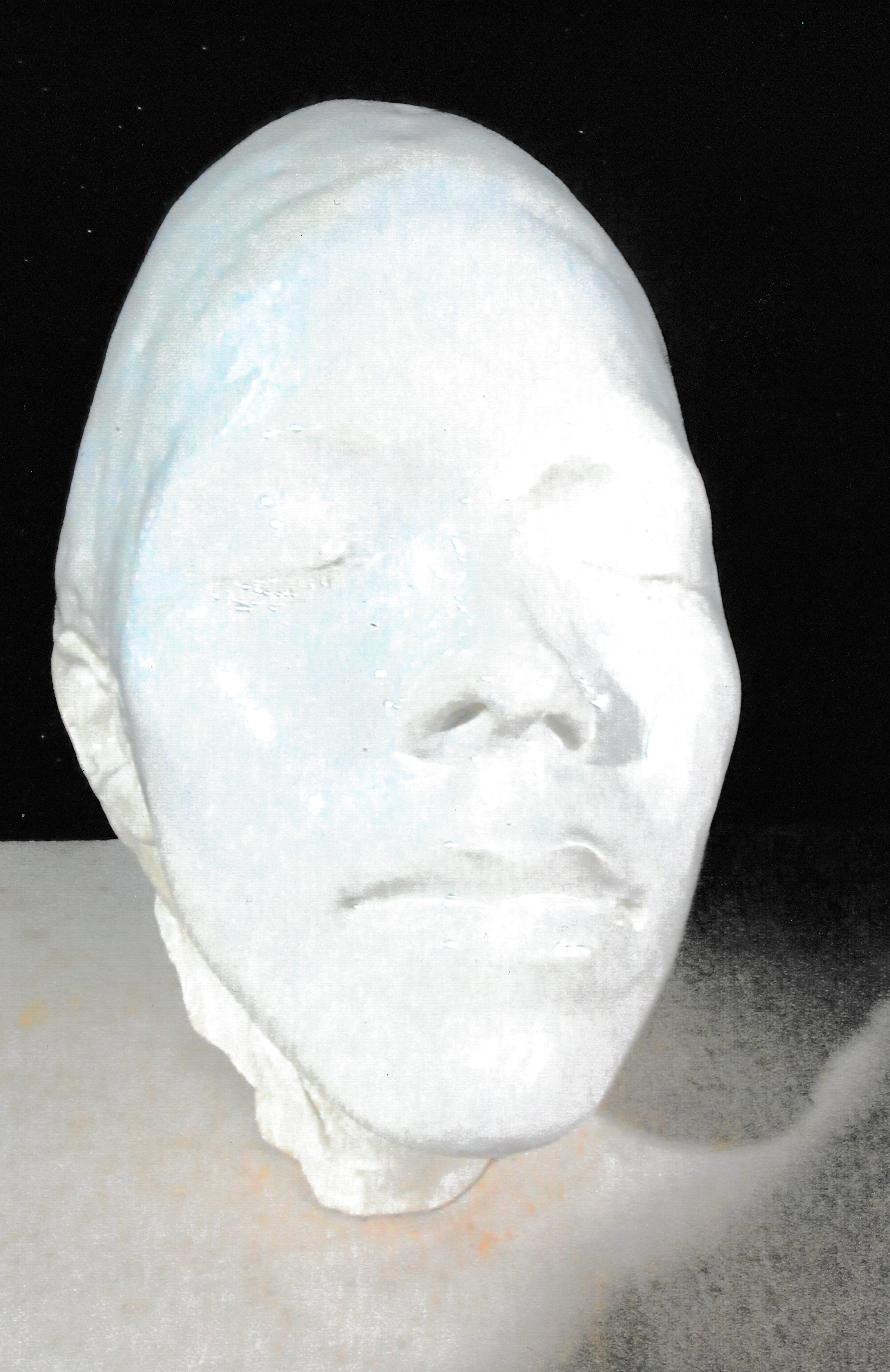 Minimal ceramic life mask with closed eyes and smooth facial planes that evoke quiet introspection.