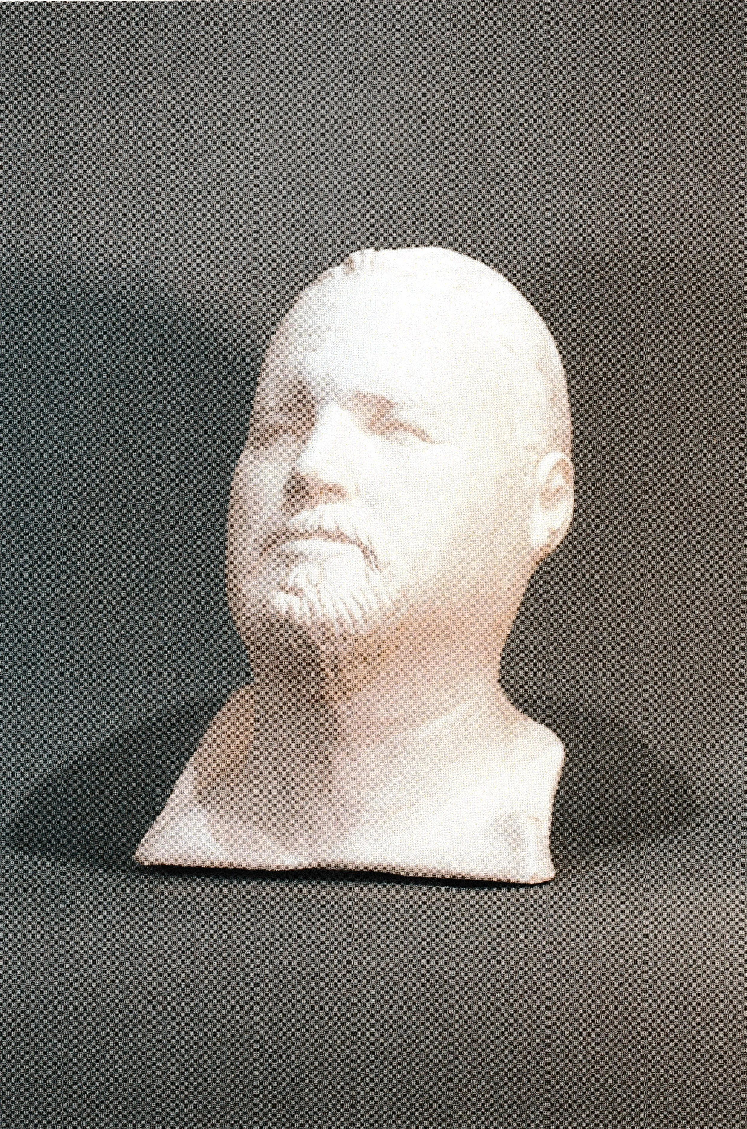 Ceramic life cast portrait of a bearded man facing slightly to one side, preserving the distinctive structure, beard texture, and individuality of the sitter.