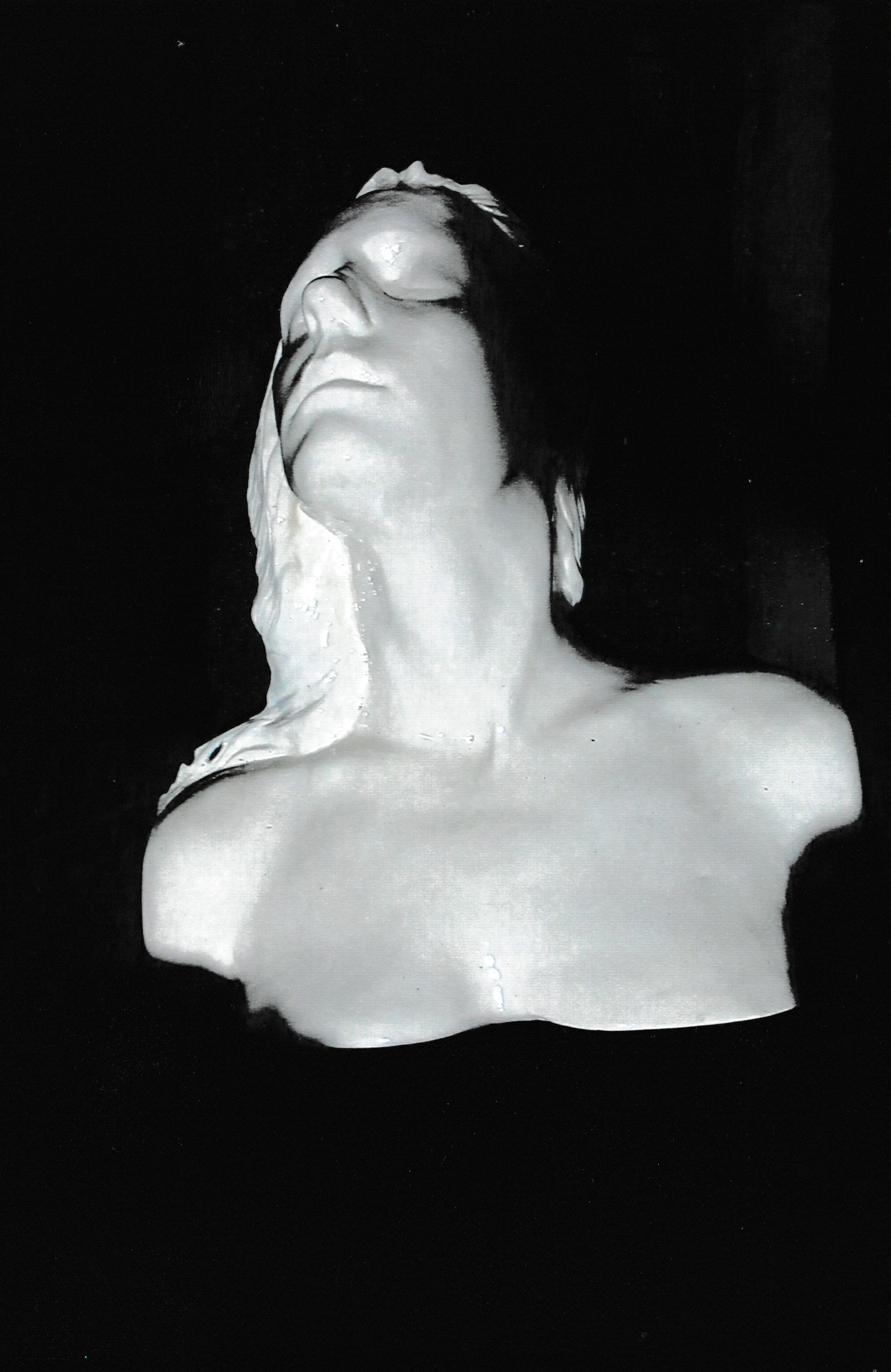 Ceramic life mask bust with face lifted upward and eyes closed, emphasizing the graceful curve of the neck and chin.
