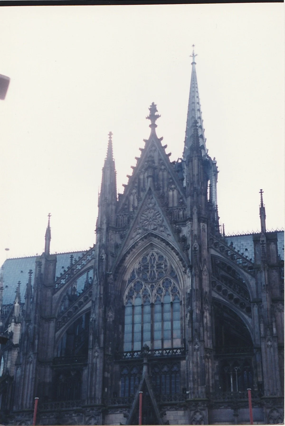 Gothic cathedral façade viewed from across a city street.