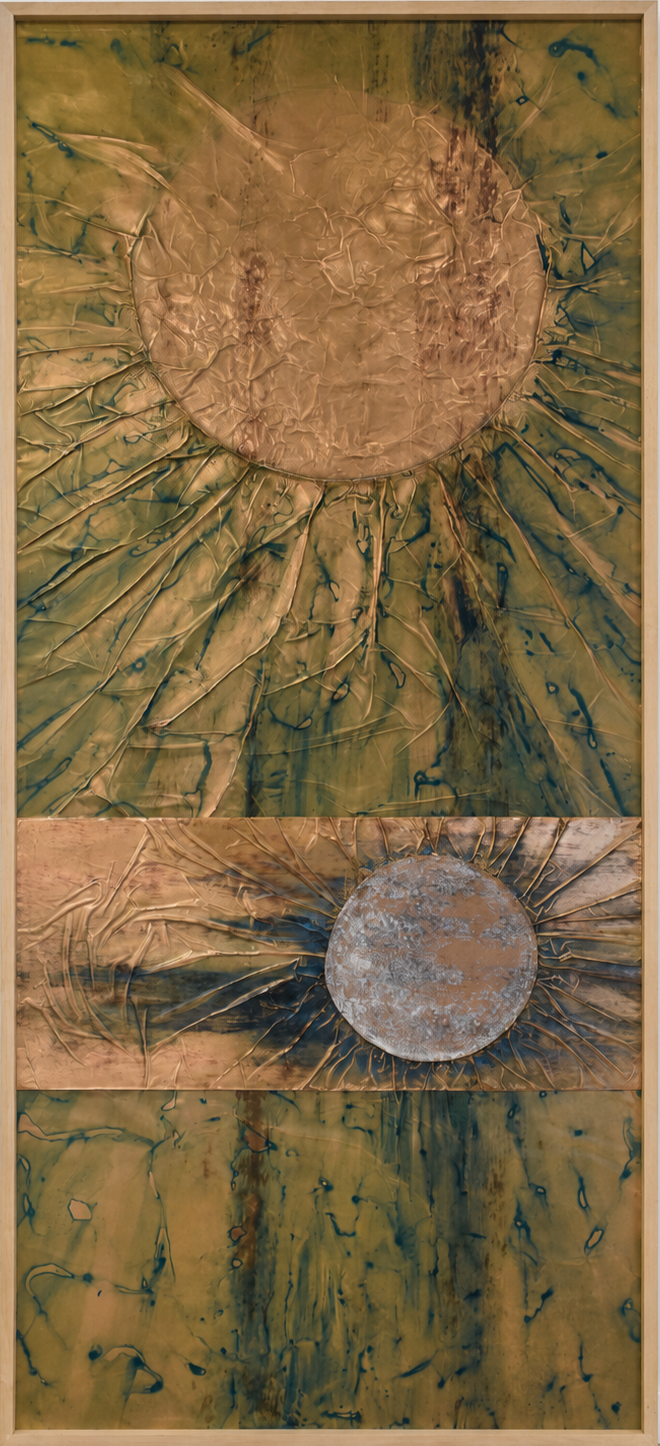 Two radiant orbs emerge within a textured field of gold and green. Shown close up in a black frame.