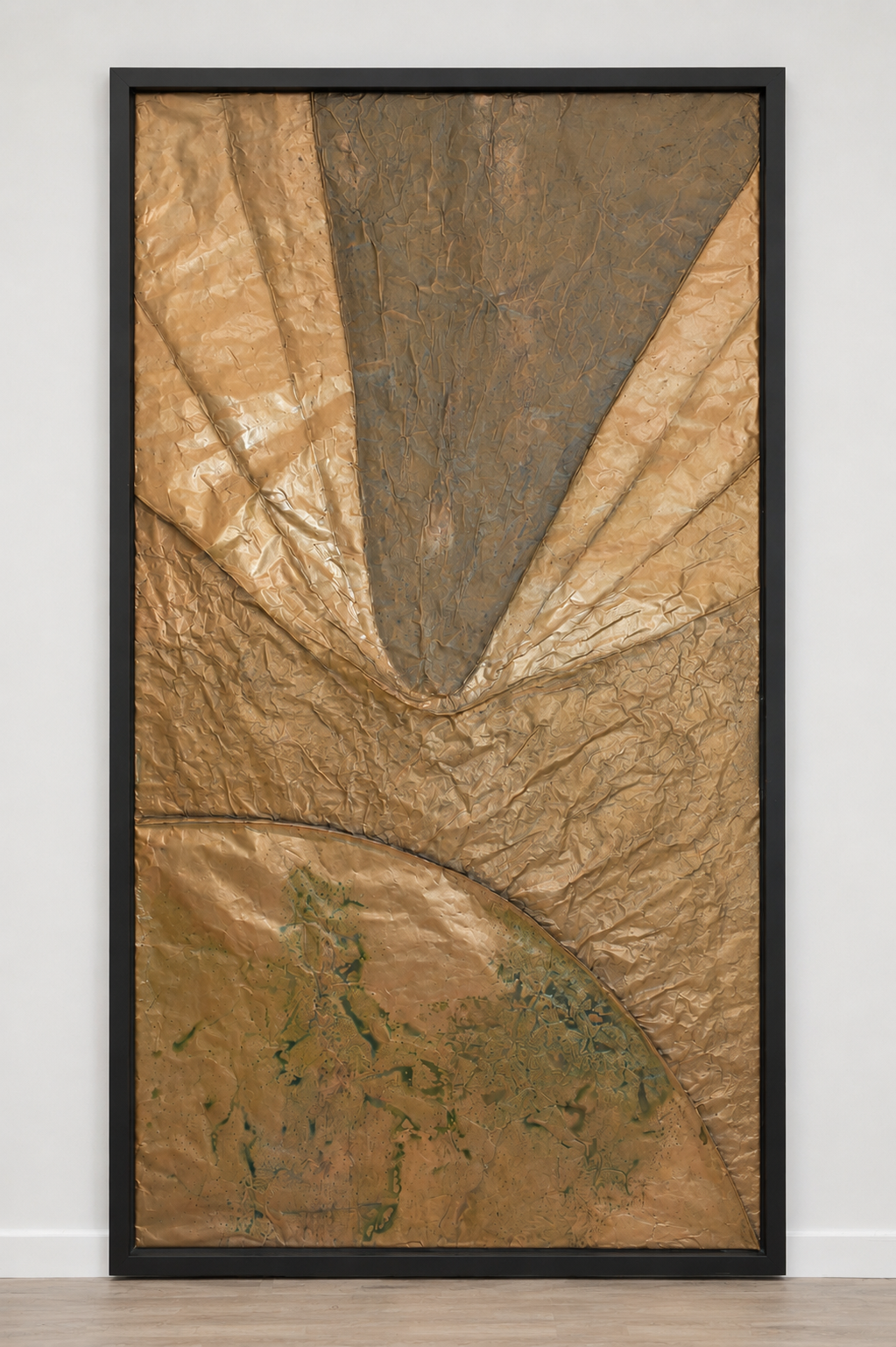Golden geometric forms converge above a curved planetary surface. Shown framed on a white wall.