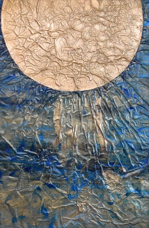 A pale orb radiates over turbulent blue currents. Shown close up without a frame.