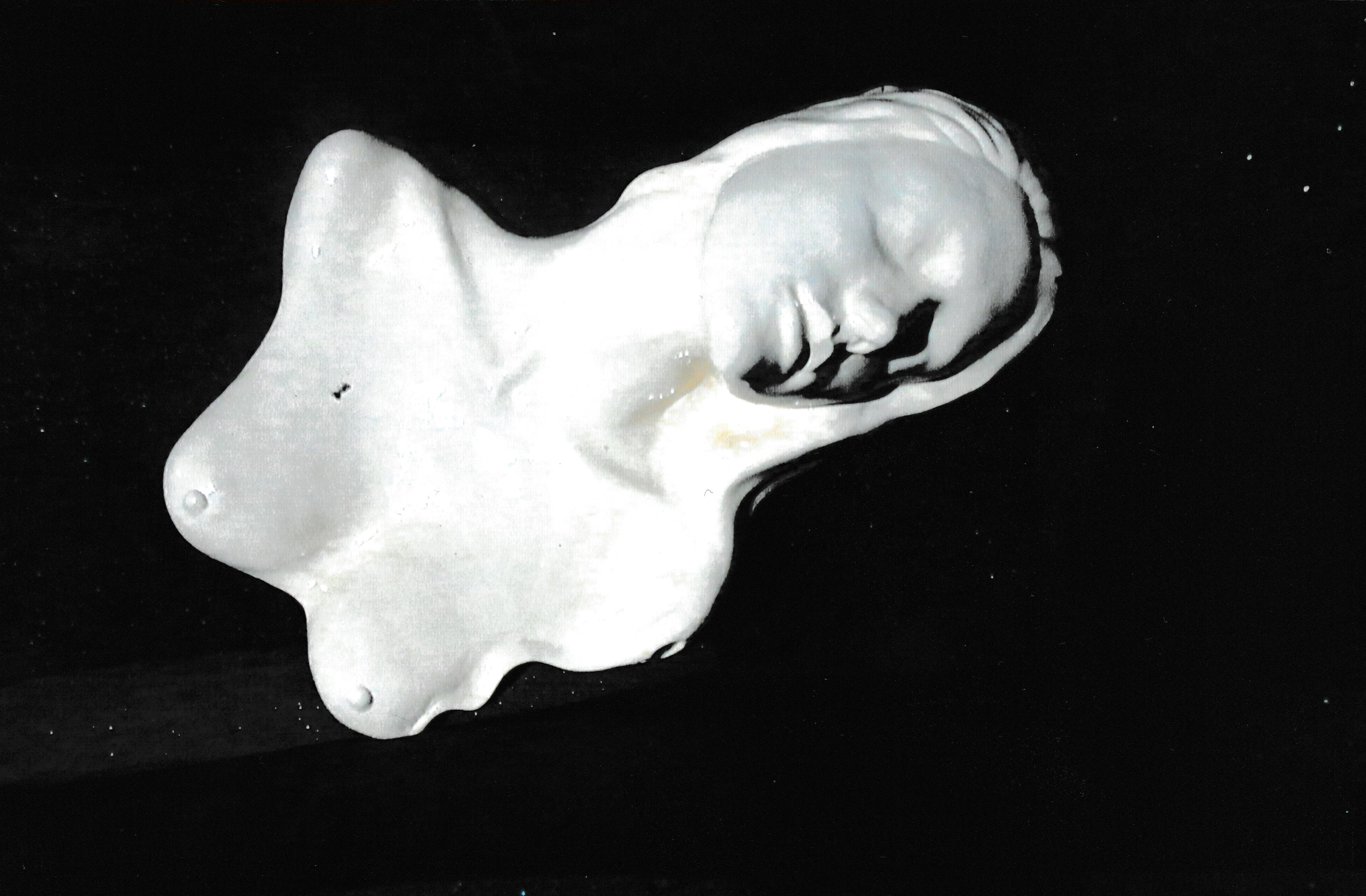 Reclining ceramic female torso viewed from above, merging the human form with flowing abstract contours.