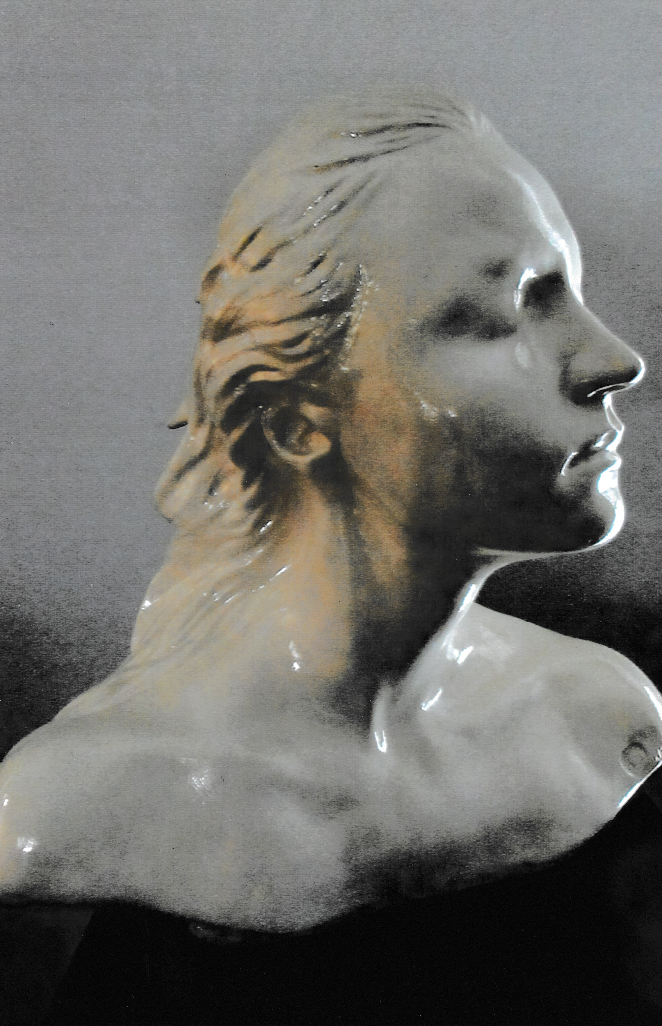 Ceramic life mask bust in profile with closed eyes and windswept hair flowing backward from the face.