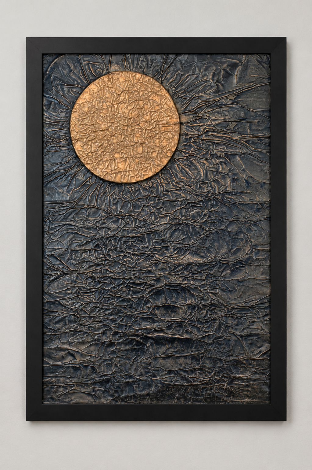 A warm, glowing orb hangs against a dark, heavily textured expanse. Shown framed on a white wall.