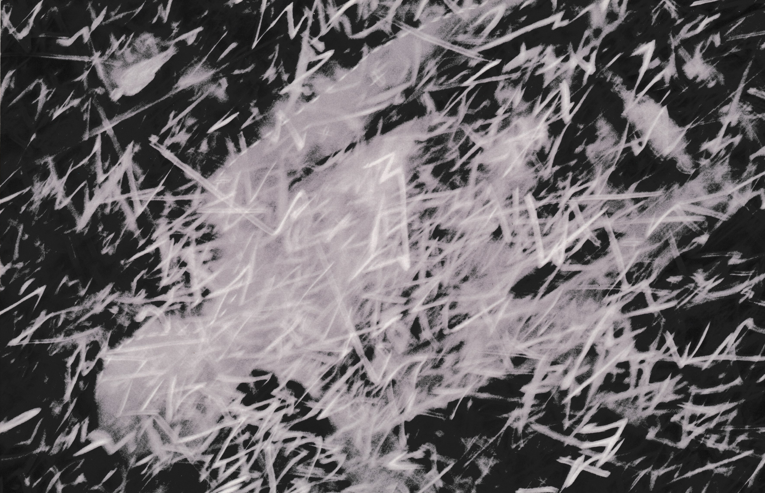 Dense field of white gestural marks and intersecting lines layered over a black surface.