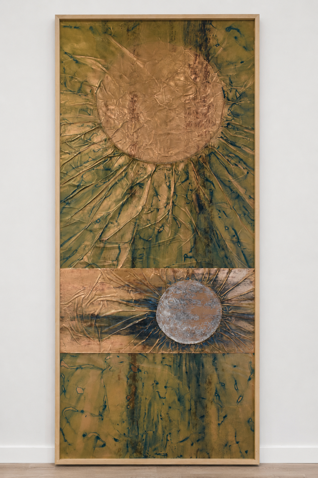 Two radiant orbs emerge within a textured field of gold and green. Shown framed on a white wall.