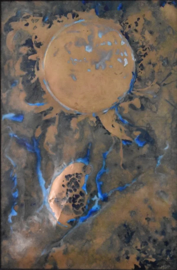 Golden planetary forms drift through smoky gray and vivid blue currents. Close up no frame.