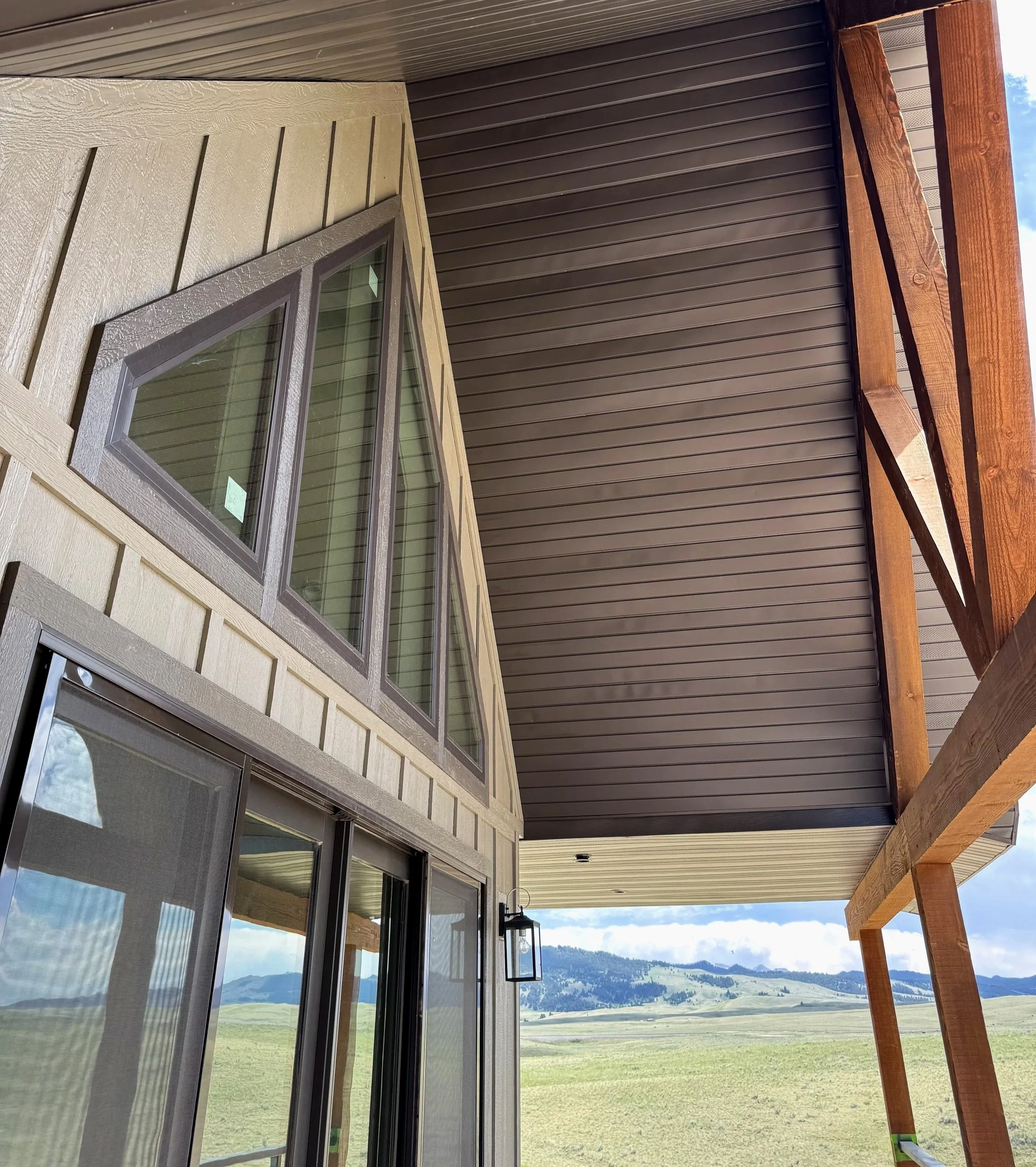 Custom angular window and loft detail — precision timber frame construction by Mihelich Custom Builders near Butte, Montana.
