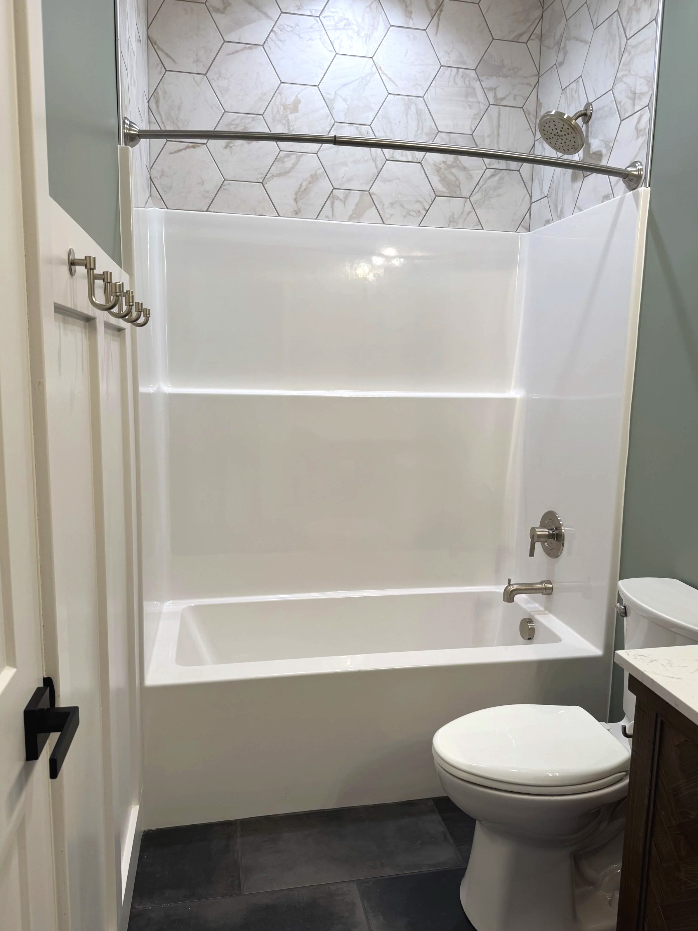 Custom bathroom with soaking tub and designer tile — luxury Montana home builder Mihelich Custom Builders near Butte, MT.