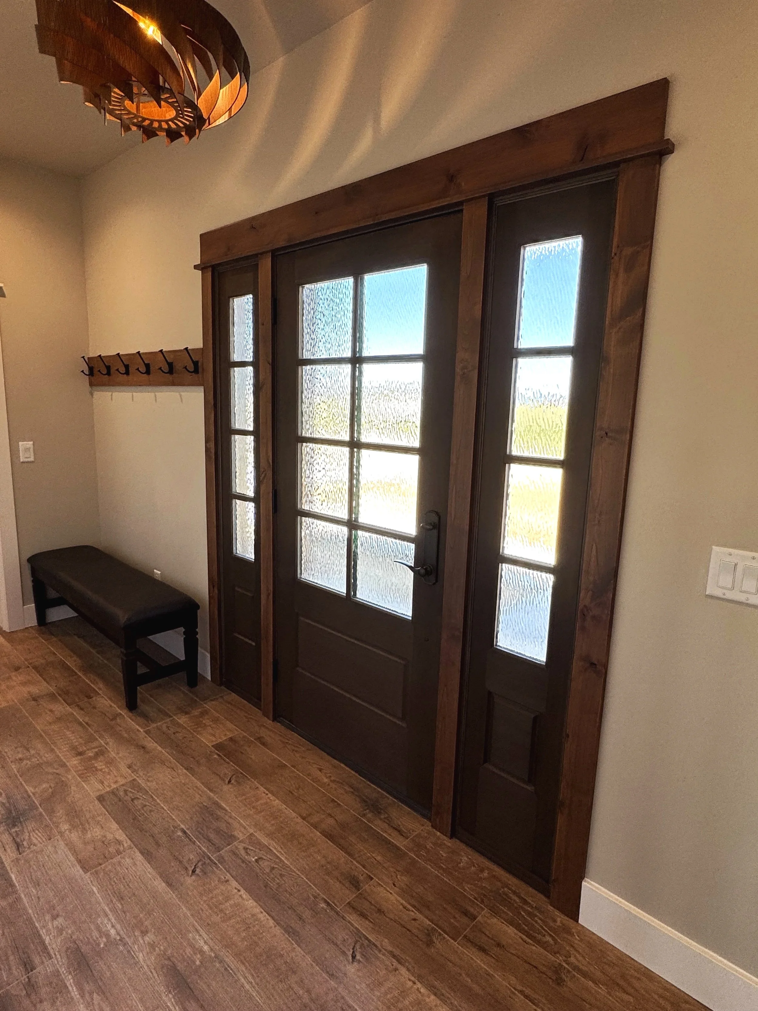 Custom doors with designer hardware — luxury entry and interior door package by Mihelich Custom Builders near Butte, Montana.
