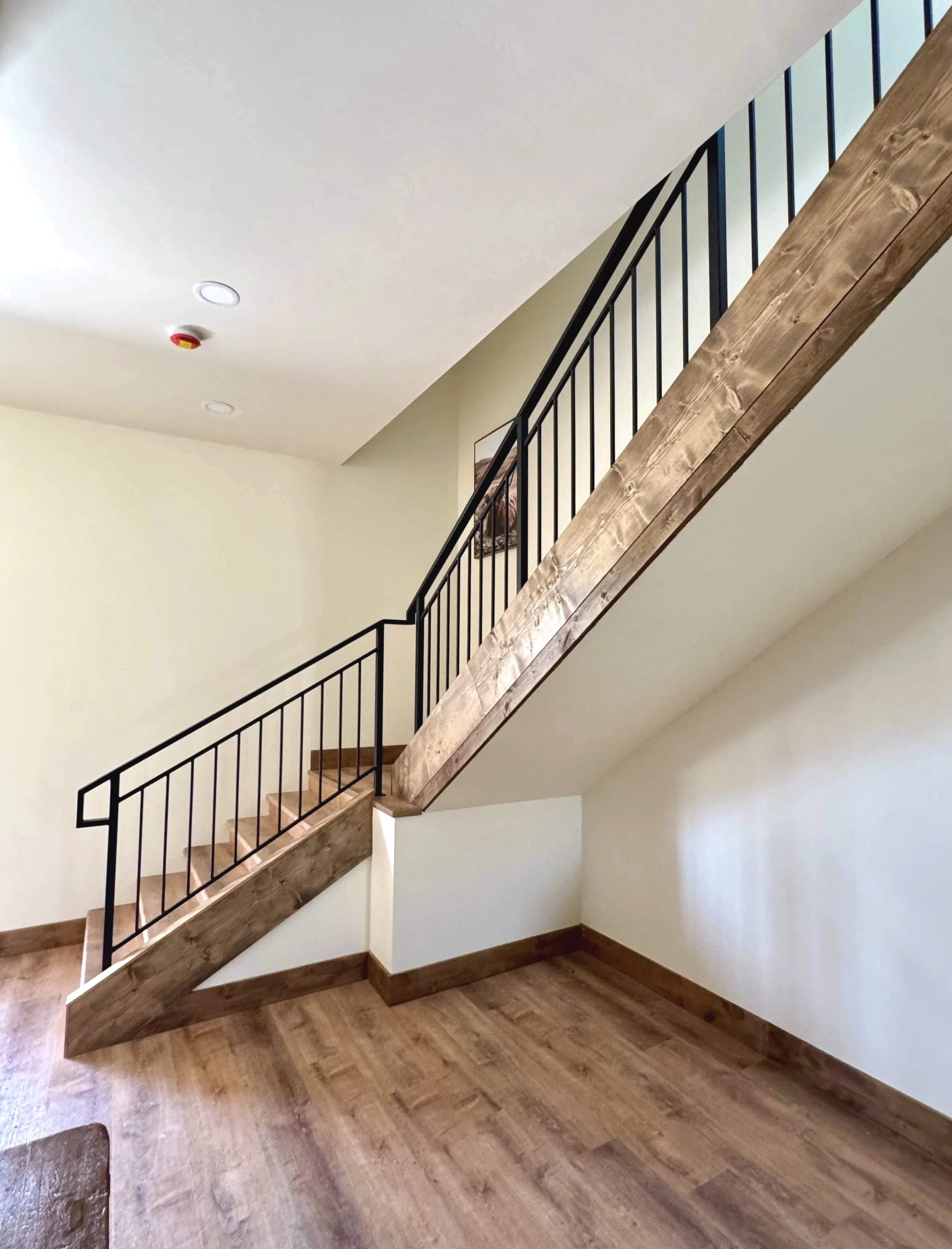 Custom wood staircase detail with quality craftsmanship — Mihelich Custom Builders, luxury home builder near Butte, MT.