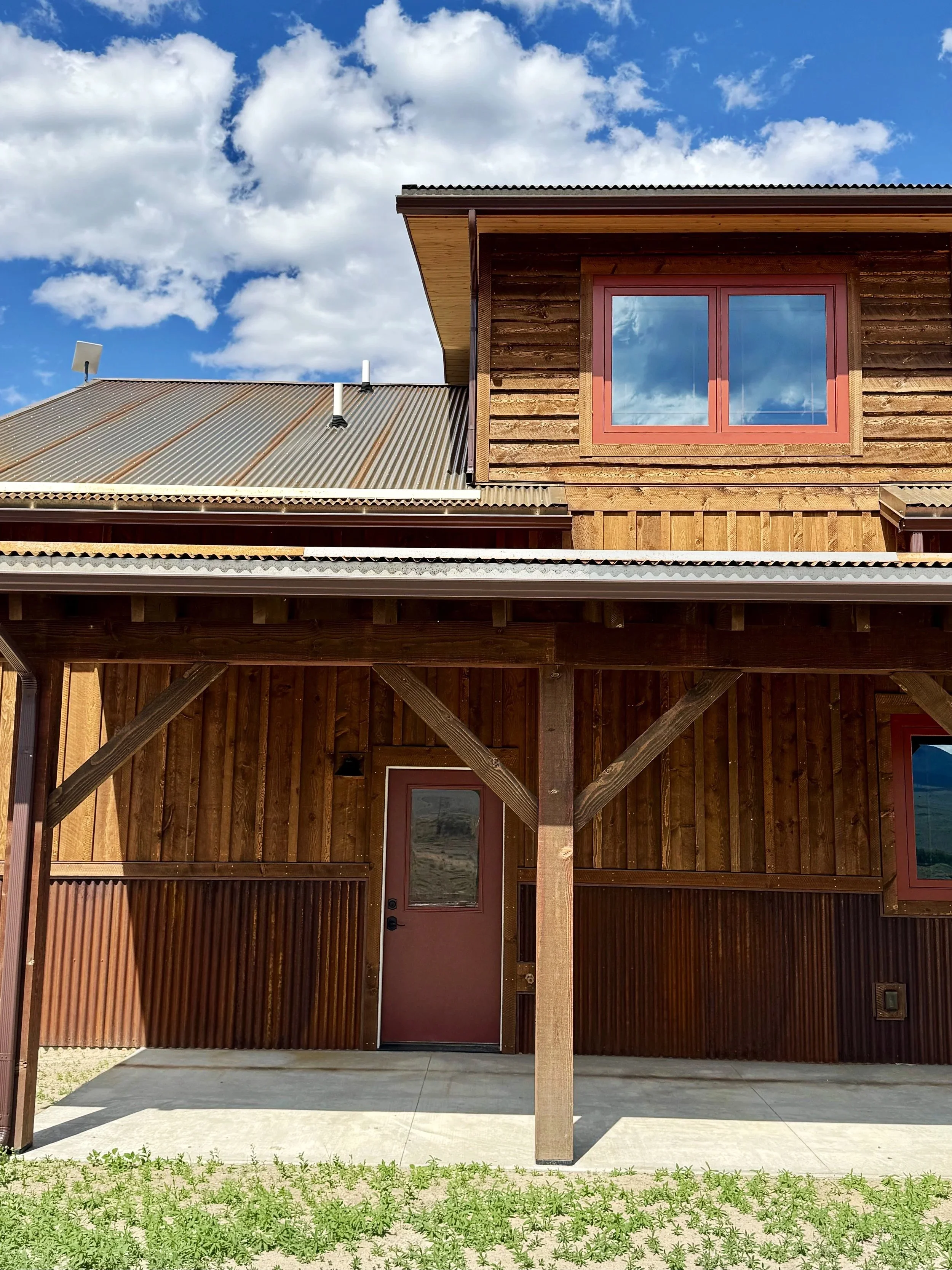 Custom home entry detail with natural wood and quality trim — rustic luxury construction by Mihelich Custom Builders near Butte, MT.