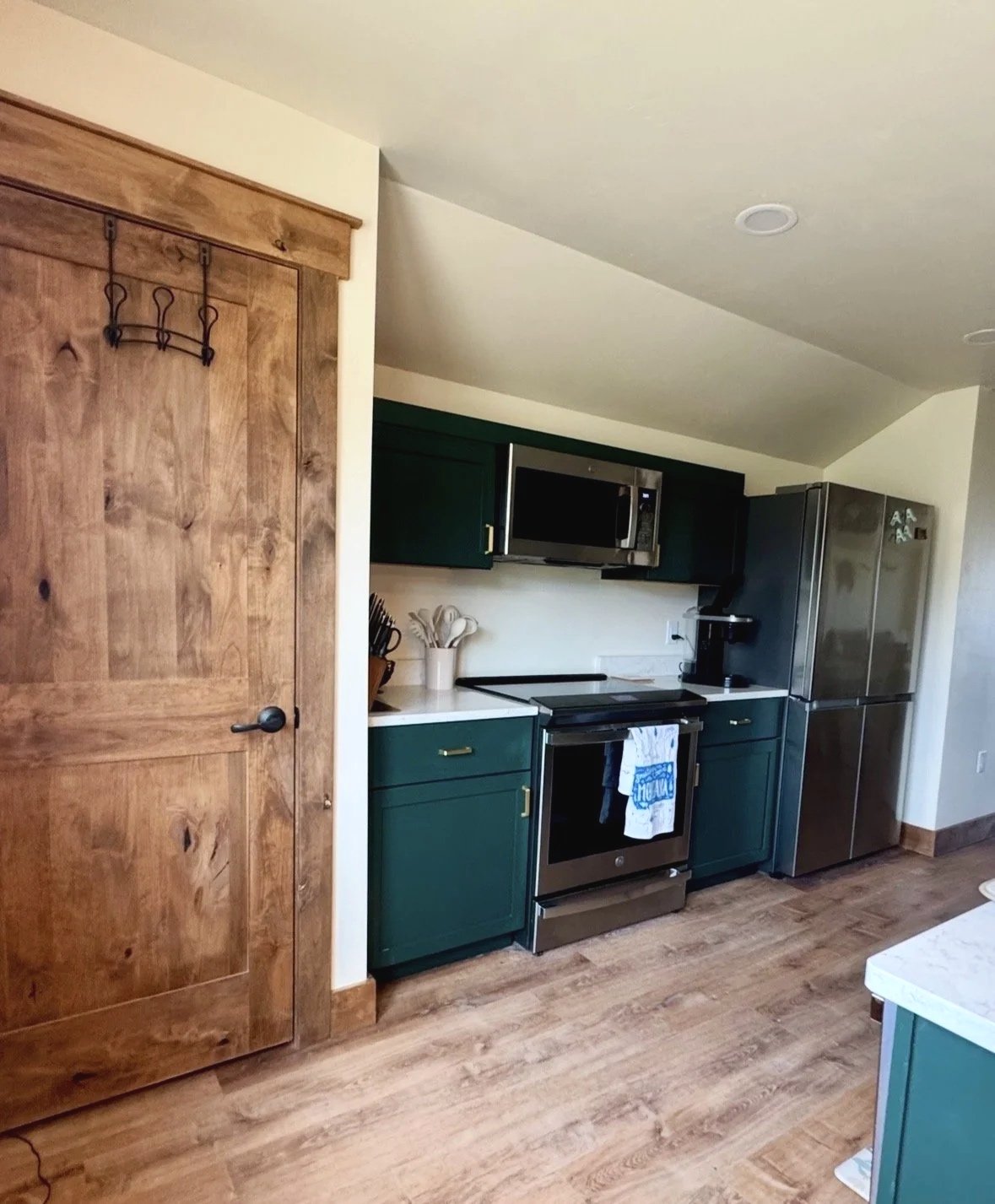 Custom kitchen and living space with quality finishes — rustic luxury construction by Mihelich Custom Builders, Glen, Montana.