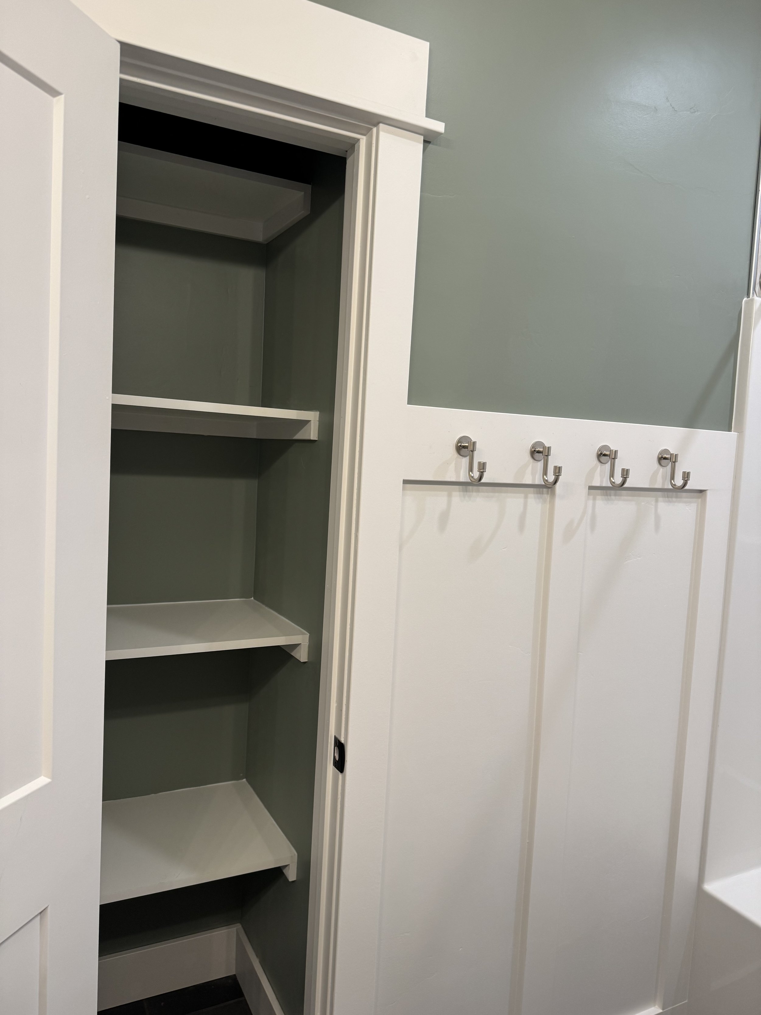 Custom mudroom and laundry room with built-in storage — functional luxury design by Mihelich Custom Builders near Butte, Montana.